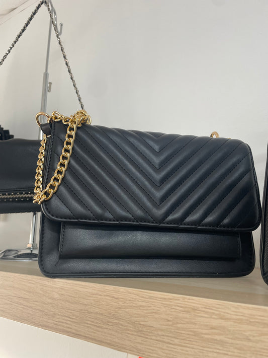 Bolso negro bordado raya