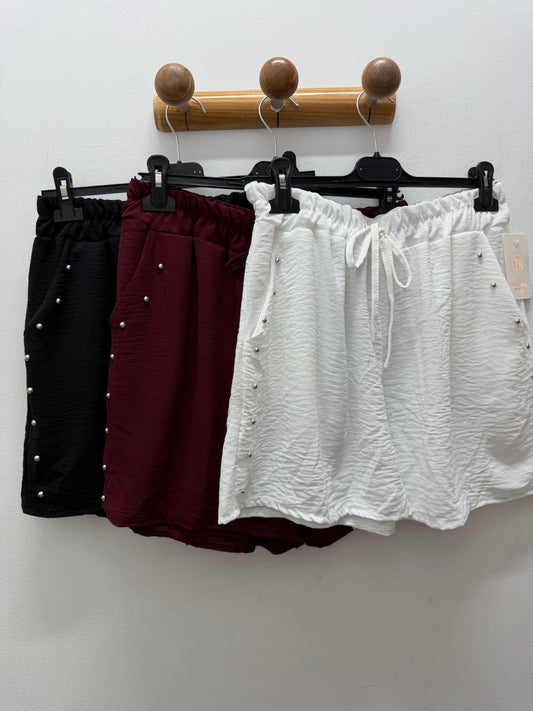 Pantalón tela tachuela
